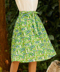 Woman wearing ModCloth The Garden Stroll Skirt in Hide & Squeak, a cotton voile A-line midi skirt with a whimsical mouse and wildflower print and removable tie belt.