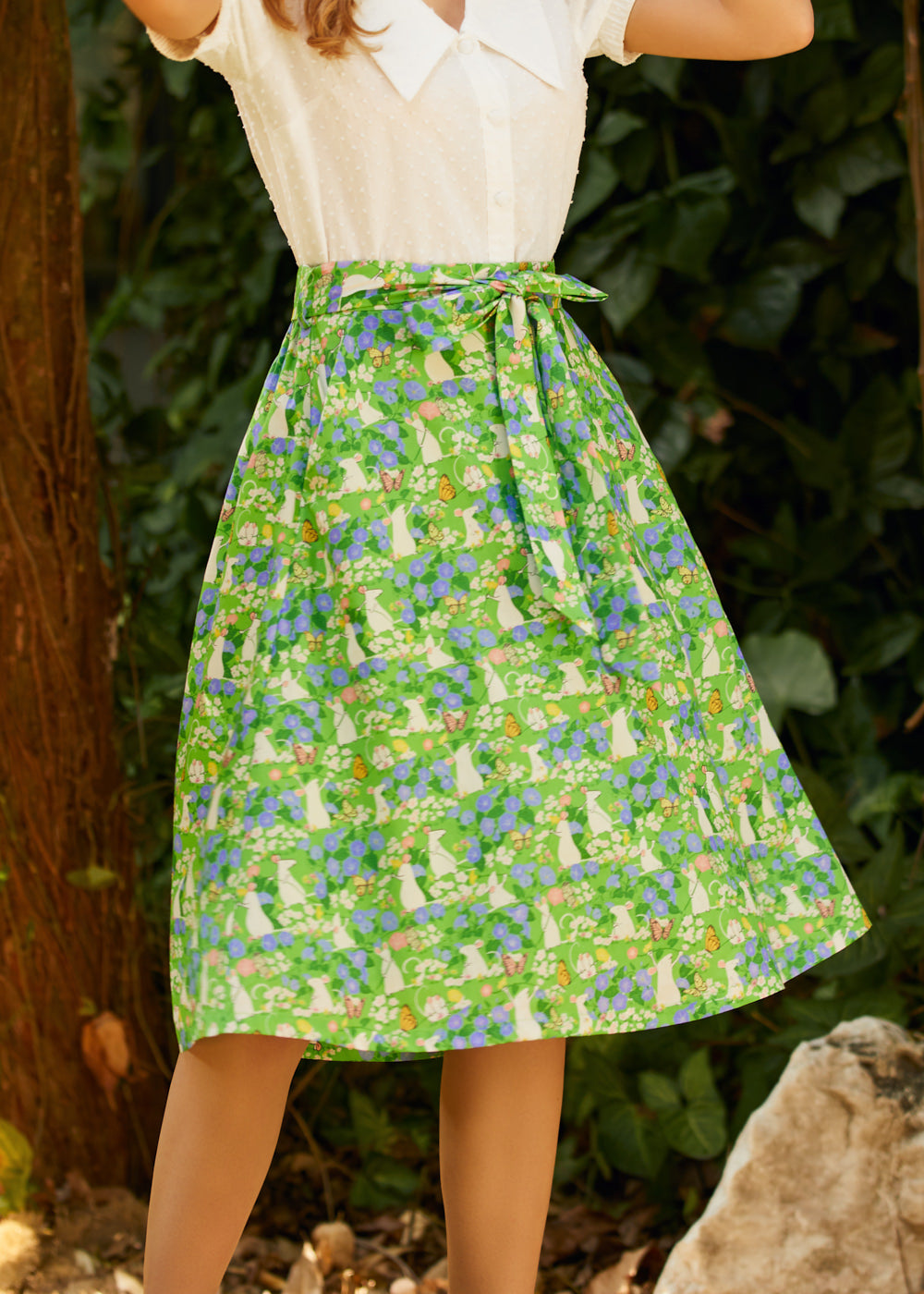 Woman wearing ModCloth The Garden Stroll Skirt in Hide & Squeak, a cotton voile A-line midi skirt with a whimsical mouse and wildflower print and removable tie belt.