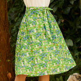 Woman wearing ModCloth The Garden Stroll Skirt in Hide & Squeak, a cotton voile A-line midi skirt with a whimsical mouse and wildflower print and removable tie belt.
