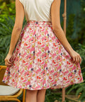 Back view of A-line skirt showing gathered waistband and full silhouette in dragonfruit print