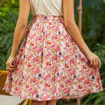 Back view of A-line skirt showing gathered waistband and full silhouette in dragonfruit print
