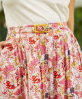 Close-up of waist detailing with coordinating belt and buckle closure