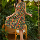 Woman in a floral dress standing outdoors with greenery in the background