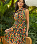 Full length view of peach print dress styled for daytime wear