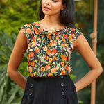 Ruffle sleeve blouse with peach print and tie neckline, front view