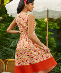 Back view of sleeveless fit and flare dress with full skirt