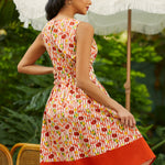 Back view of sleeveless fit and flare dress with full skirt