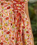 Close-up of corset-style bodice with structured seams and novelty print detail