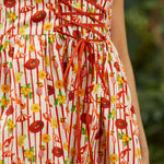 Close-up of corset-style bodice with structured seams and novelty print detail