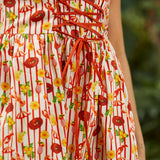 Close-up of corset-style bodice with structured seams and novelty print detail
