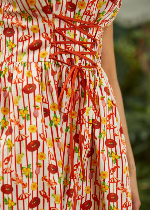 Close-up of corset-style bodice with structured seams and novelty print detail