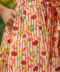 Close-up of a dress with red and yellow pattern on a blurred background