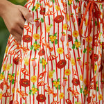 Close-up of a dress with red and yellow pattern on a blurred background