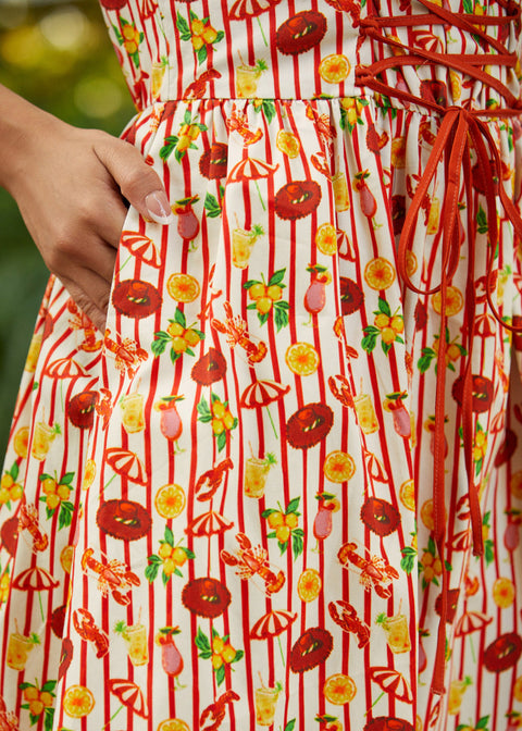 Close-up of a dress with red and yellow pattern on a blurred background