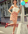 Model wearing Kitschy Coastal paperbag waist shorts with tie belt and pockets