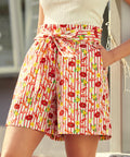 Side view of shorts highlighting pockets and coastal novelty print