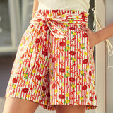 Side view of shorts highlighting pockets and coastal novelty print