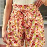 woman wearing vintage style paper bag waist shorts with novelty print