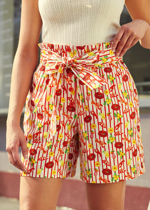 woman wearing vintage style paper bag waist shorts with novelty print