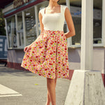 High-waisted pleated A-line skirt with button front and coastal print, front view