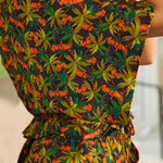 Colorful patterned dress with a belt, worn by a person.