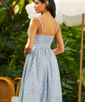 Back view of vintage-inspired sundress with ruched bodice, smocked back, and adjustable straps