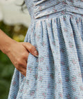 Floral gingham fit and flare sundress with side pocket detail and softly gathered skirt