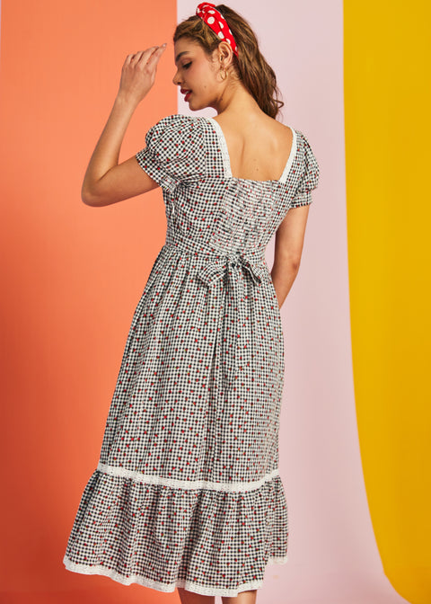 Back view of gingham midi dress with smocked back and waist tie detail