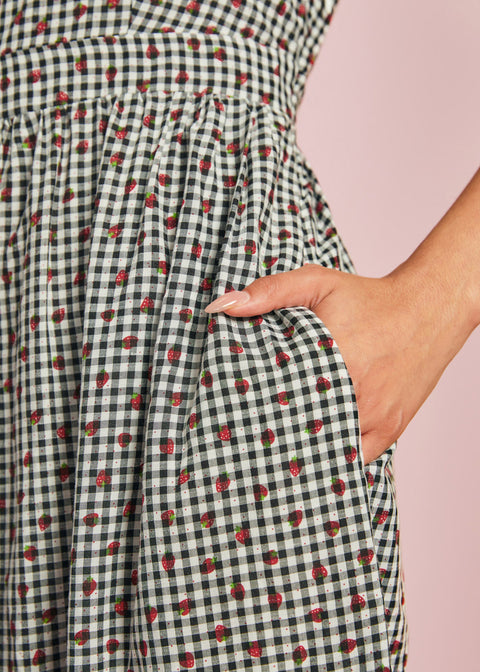 Close-up of strawberry gingham cotton fabric and side pocket detail