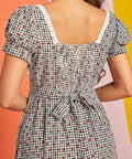 Close-up of lace-trimmed square neckline on strawberry gingham midi dress