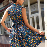 Back view of a farmyard chicken print dress with self-tie sash and novelty farmyard print.