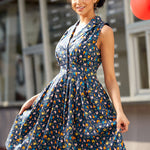 Side view of a vintage inspired chicken print dress showing the flattering silhouette and full skirt.
