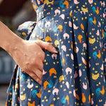 Close-up of side pocket on the Hen House Party novelty chicken print cotton dress.