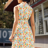 Back view of a sleeveless fit-and-flare cotton dress with collared neckline and vegetable print.