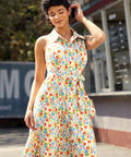 Front view of a retro fit-and-flare shirt dress featuring a whimsical vegetable print and removable sash belt.