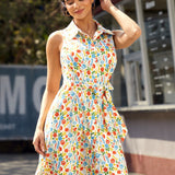 Front view of a retro fit-and-flare shirt dress featuring a whimsical vegetable print and removable sash belt.