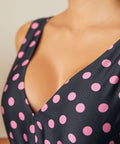 Close-up of V-neckline and textured woven fabric