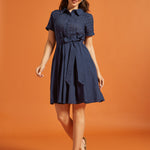 Full-length view of a navy cotton fit-and-flare dress with an eyelet bodice, collared neckline, and gathered skirt.