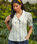 Front view of the Dear Diary Blouse in Blue Willow featuring a floral stripe print, oversized collar, and fabric-covered button front.