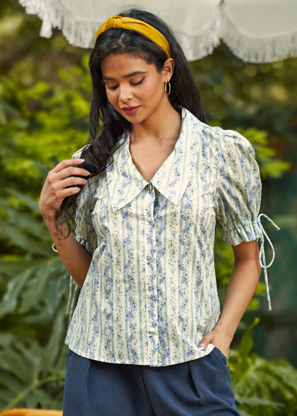 Front view of the Dear Diary Blouse in Blue Willow featuring a floral stripe print, oversized collar, and fabric-covered button front.