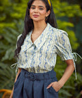 The Dear Diary Blouse tucked into high-waisted shorts, highlighting the vintage-inspired silhouette and tailored fit.