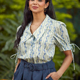 The Dear Diary Blouse tucked into high-waisted shorts, highlighting the vintage-inspired silhouette and tailored fit.