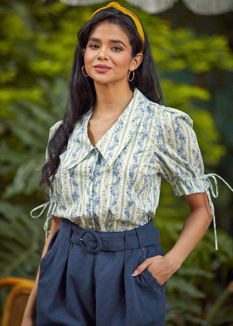 The Dear Diary Blouse tucked into high-waisted shorts, highlighting the vintage-inspired silhouette and tailored fit.