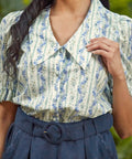 Close-up of the oversized pointed collar and covered button placket on the Dear Diary Blouse in Blue Willow.