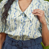 Close-up of the oversized pointed collar and covered button placket on the Dear Diary Blouse in Blue Willow.
