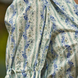 Detail of the adjustable tie cuff and softly gathered puff sleeve on the Dear Diary Blouse in Blue Willow.