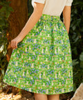 Back view of The Garden Stroll Skirt in Hide & Squeak showcasing the gathered waist, removable self-tie sash, and whimsical mouse and floral print.