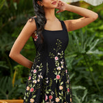 square neck a line party dress with gored panels flattering fit and flare shape angled front view