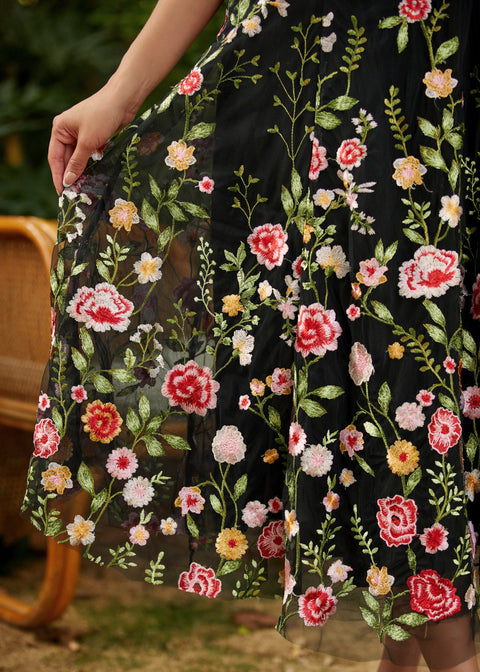 gored skirt detail on fit and flare party dress showing floral embroidery flowy a line shape and fabric movement