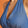 Detail of the plunging halter neckline and empire waist on a retro-inspired jumpsuit.